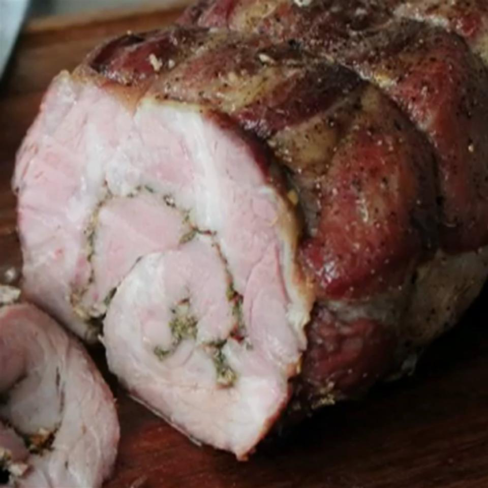 close up view of Porchetta on a wooden cutting board