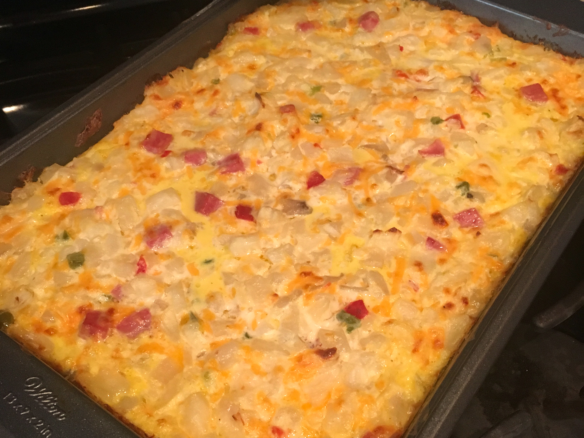 close up view of a Breakfast Casserole in a baking dish on a stove