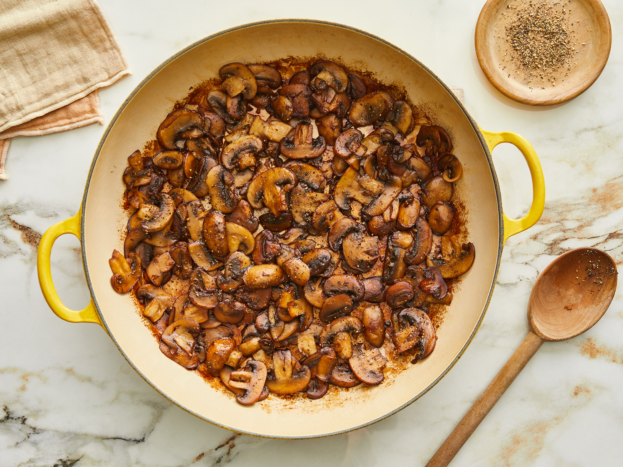 looking down at a pan of mushrooms with a soy sauce glaze
