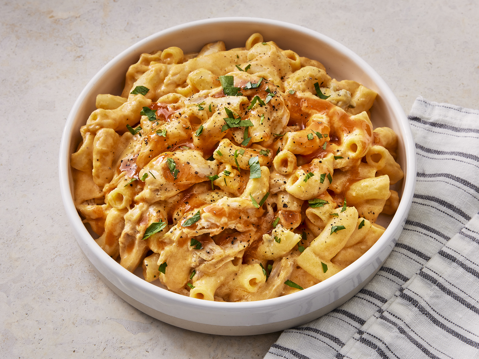 close up on a bowl of buffalo chicken mac and cheese