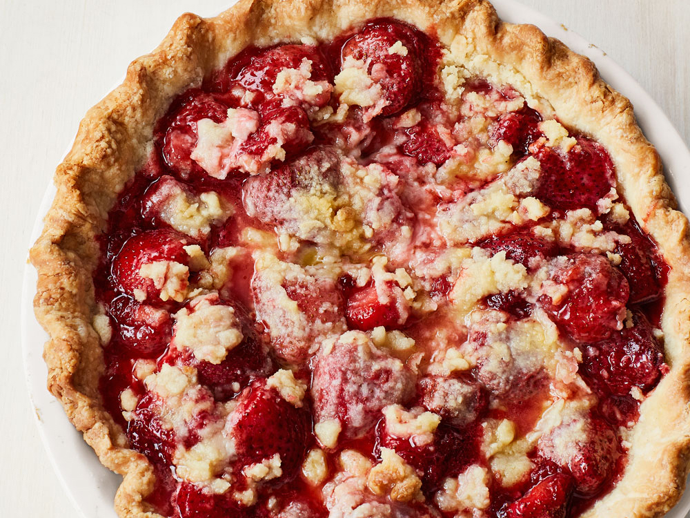 close up view of Strawberry Pie with a crumble on top, in a pie pan