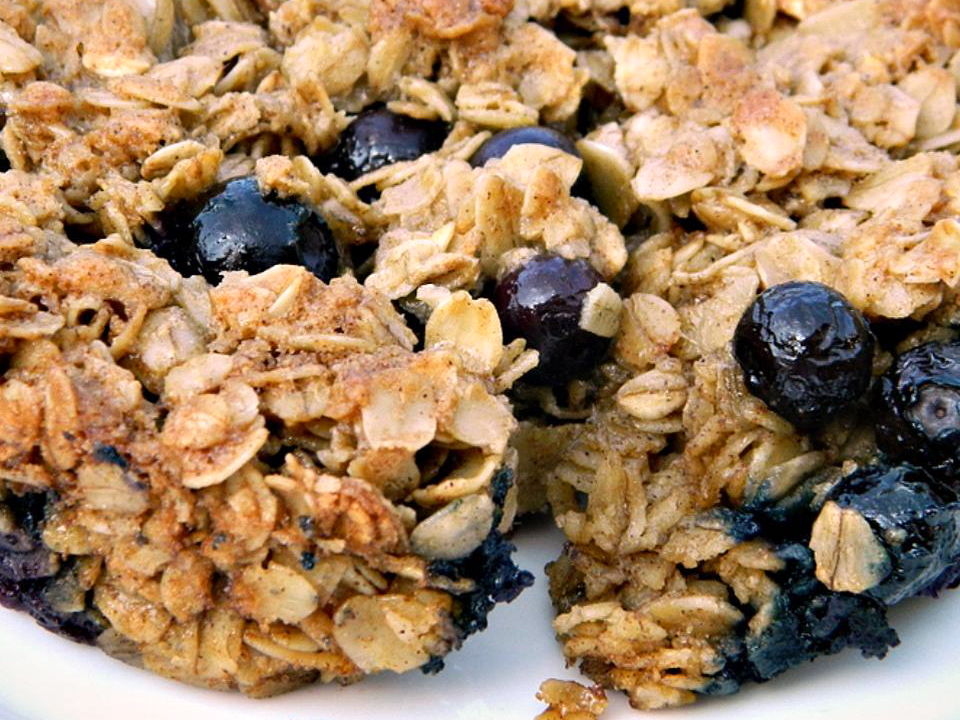 close up view of Crispy Baked Oatmeal with blueberries on a plate