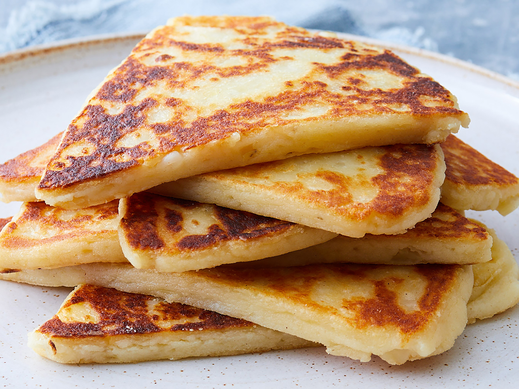 close up on a stack of browned potato scones