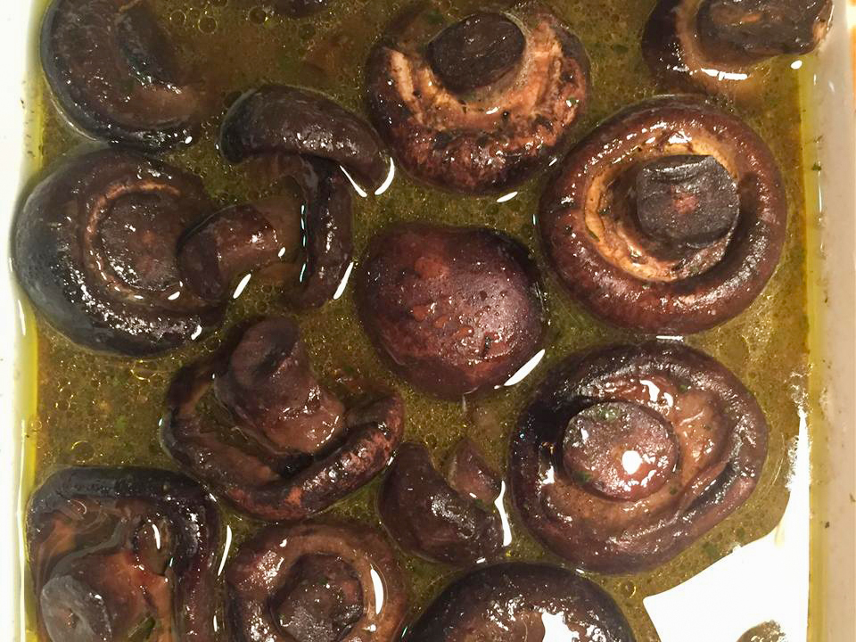 close up view of Crock-Pot Mushrooms with sauce in a white bowl