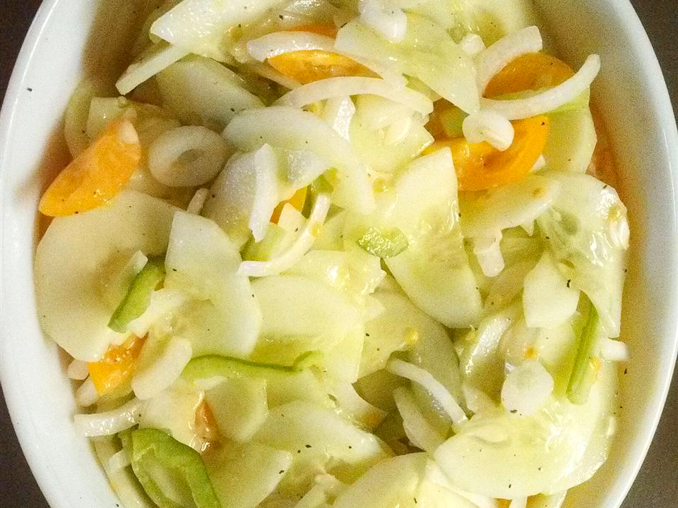 close up view of Sour Cream Cucumber Salad in a bowl