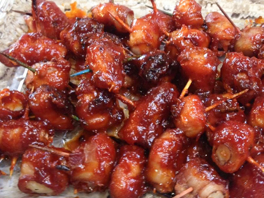 close up view of Spicy Bacon Wrapped Water Chestnuts with toothpicks