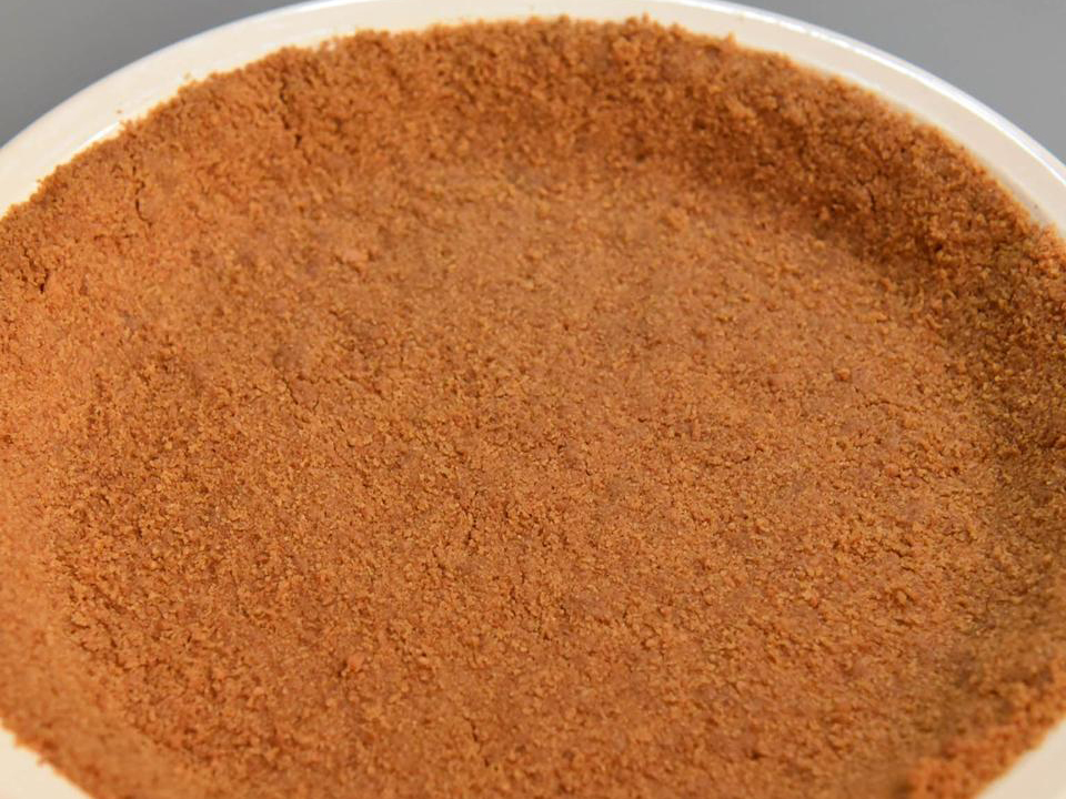 close up view of Sugar-Free Graham Cracker Crust in a white pie pan