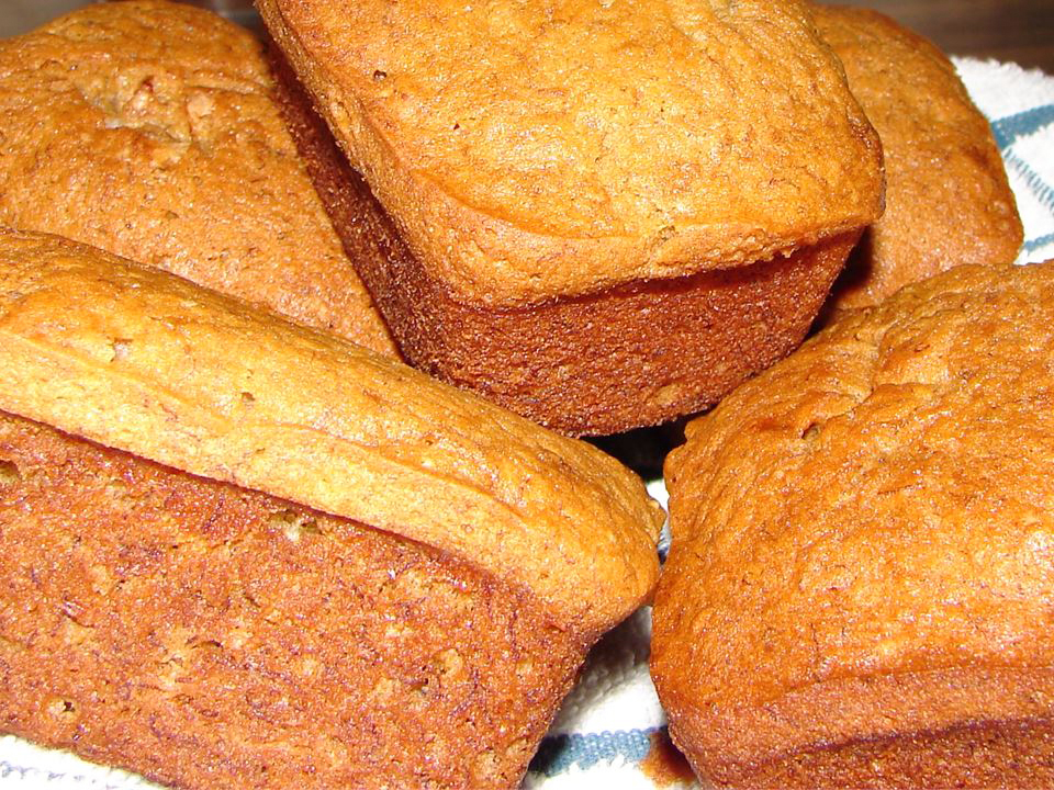 close up view of a pile of Banana Bread loaves on a towel