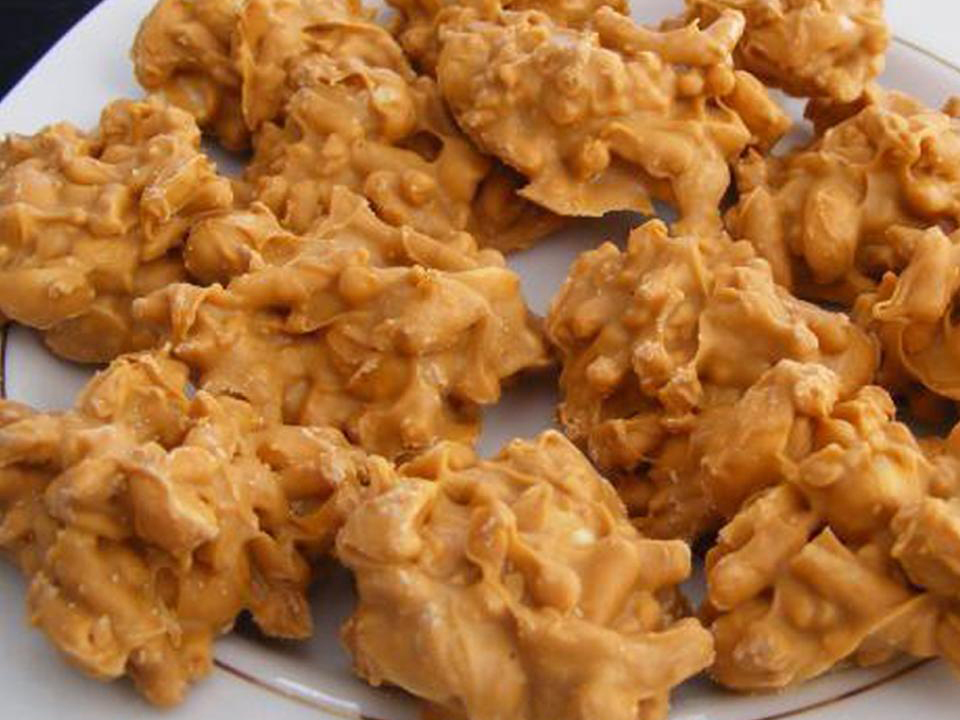 close up view of a pile of Peanut Butter Shoestring Haystacks on a plate