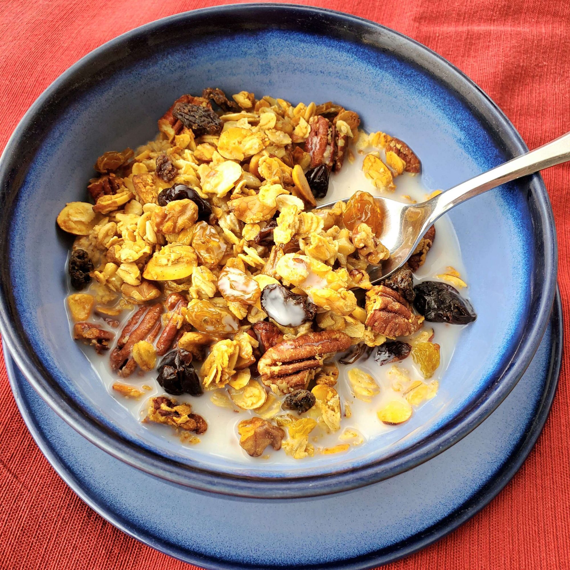 granola in bowl with milk