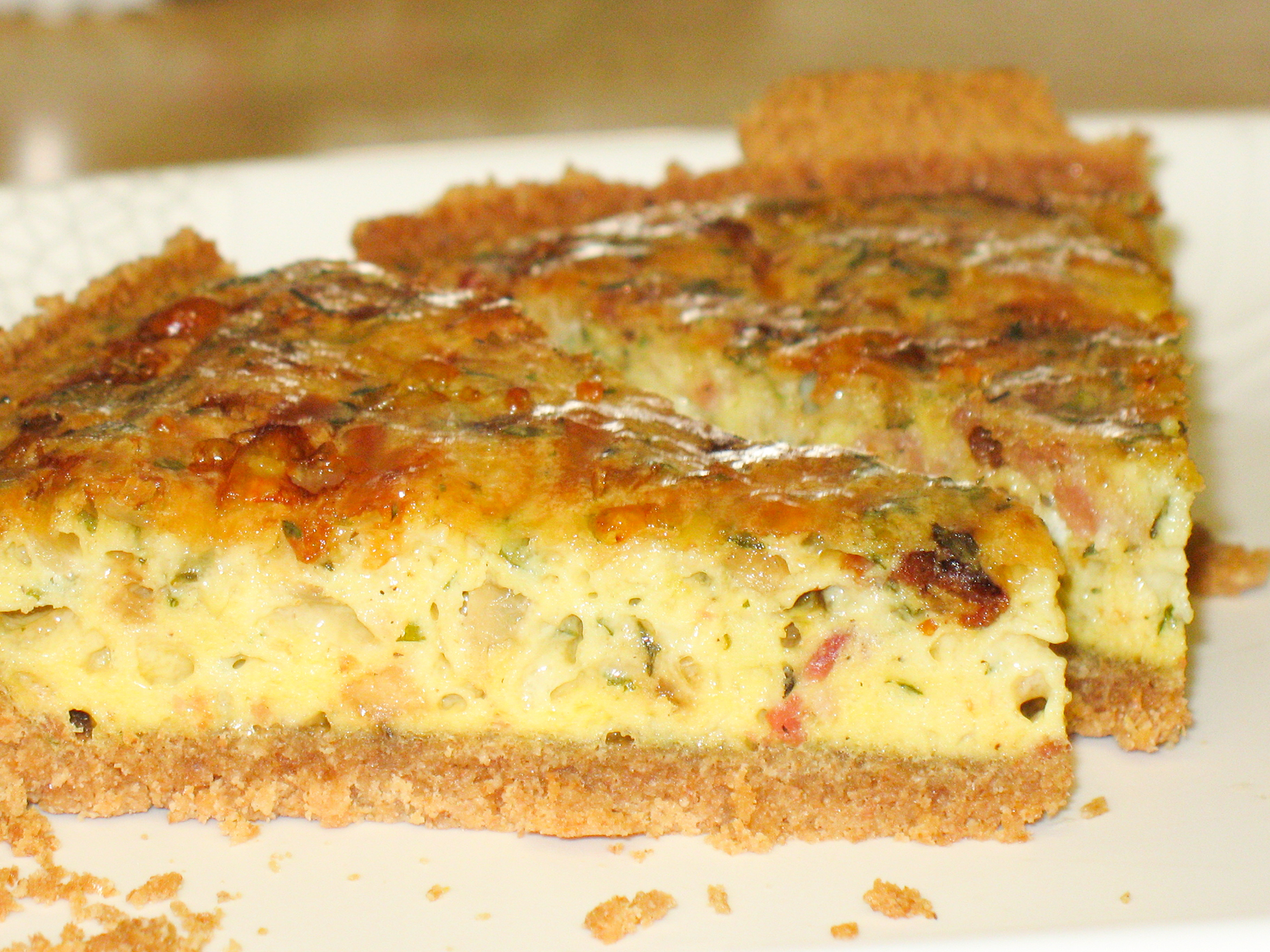 close up view of two slices of Country Quiche on a white plate