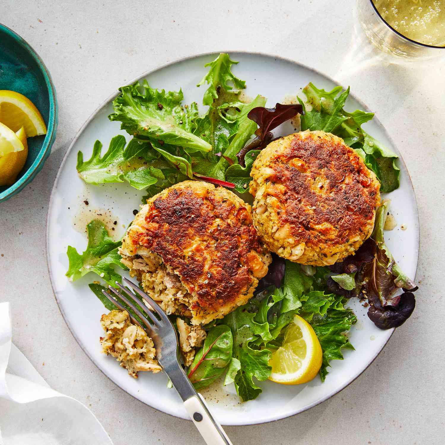 Easy Herby Tuna Cakes over Greens