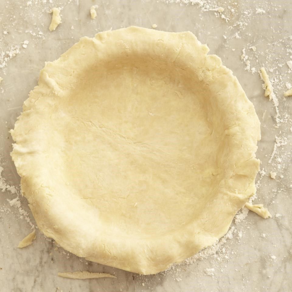raw Pie dough in a pie pan