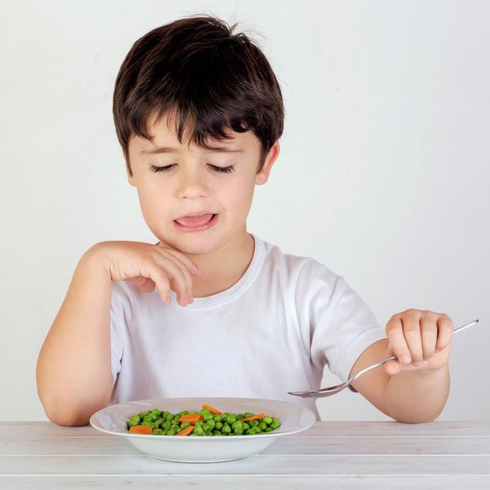 boy eating peas