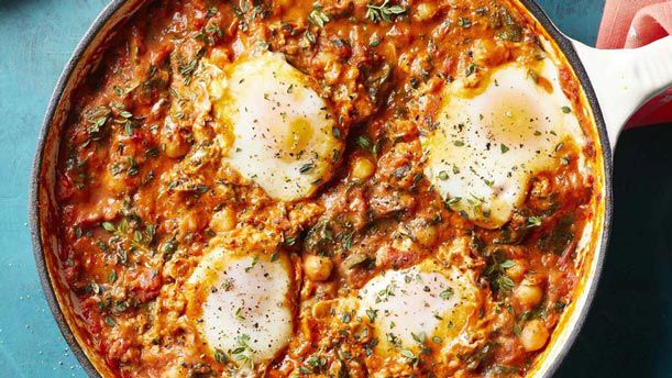 eggs in skillet with tomato sauce