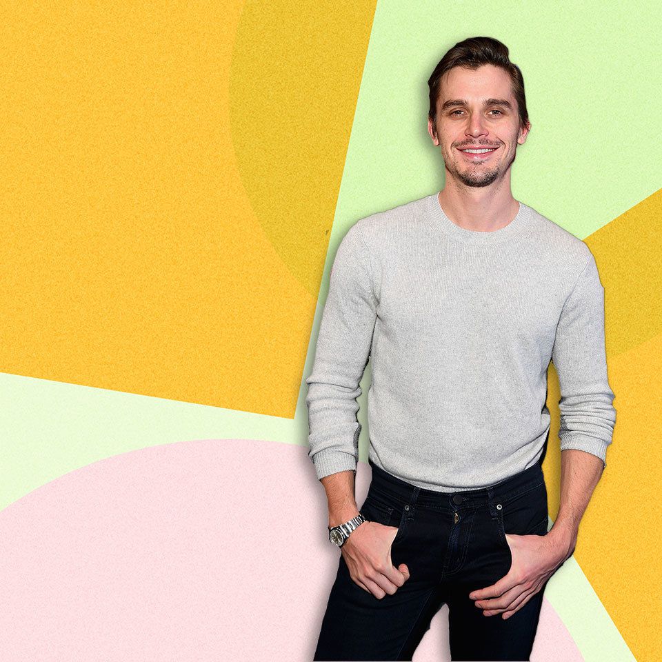 Antoni Porowski standing against a colorful background