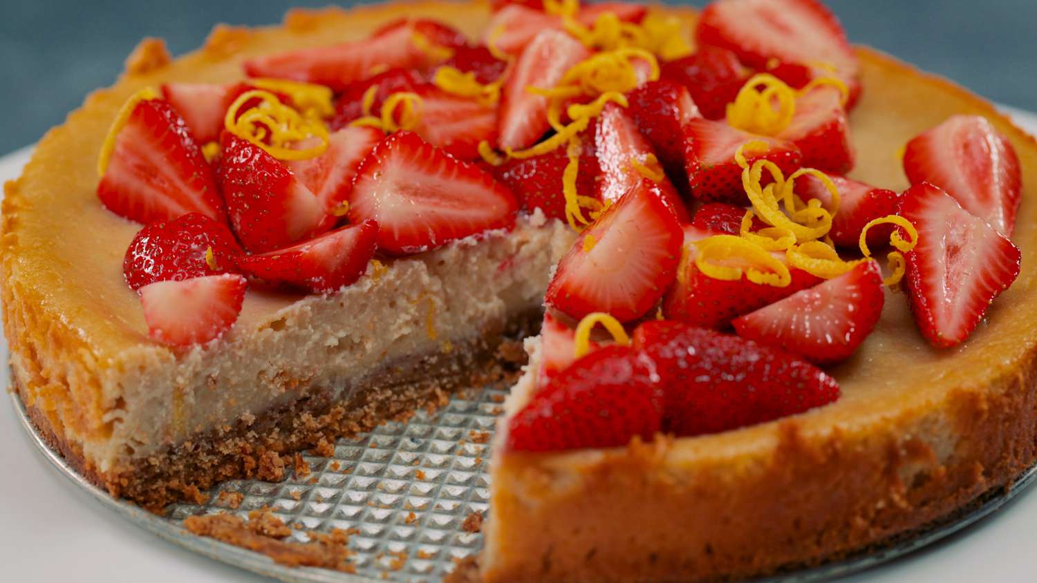 vegan cheesecake with strawberries and citrus zest