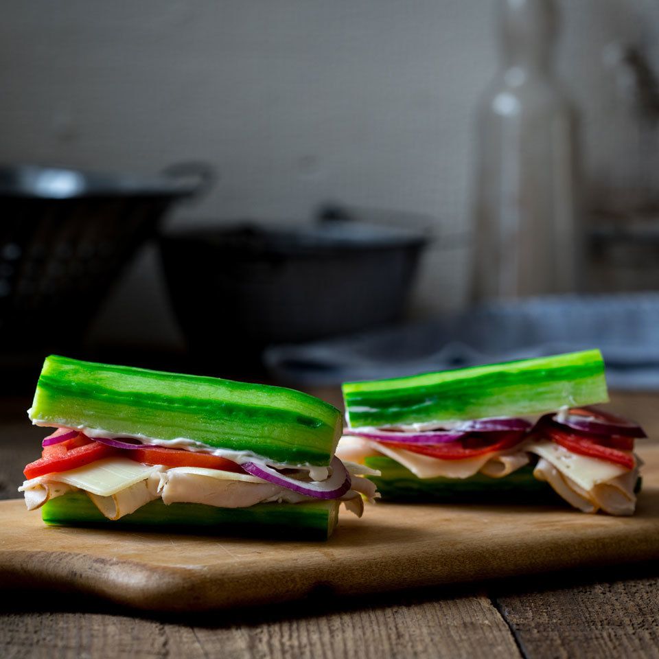 two sandwich halves on a board
