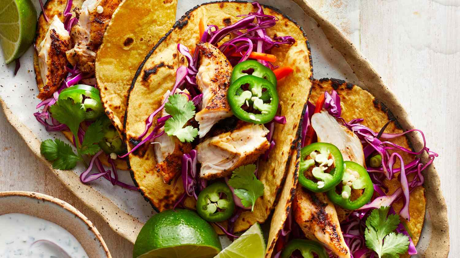 Grilled Chicken Tacos with Slaw & Lime Crema 