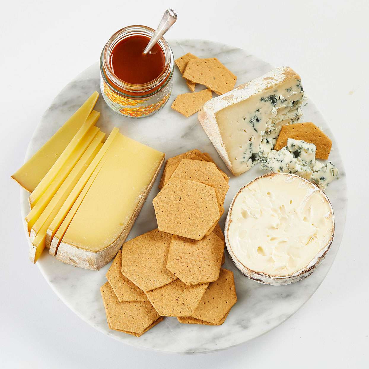 cheese plate with crackers and sauce
