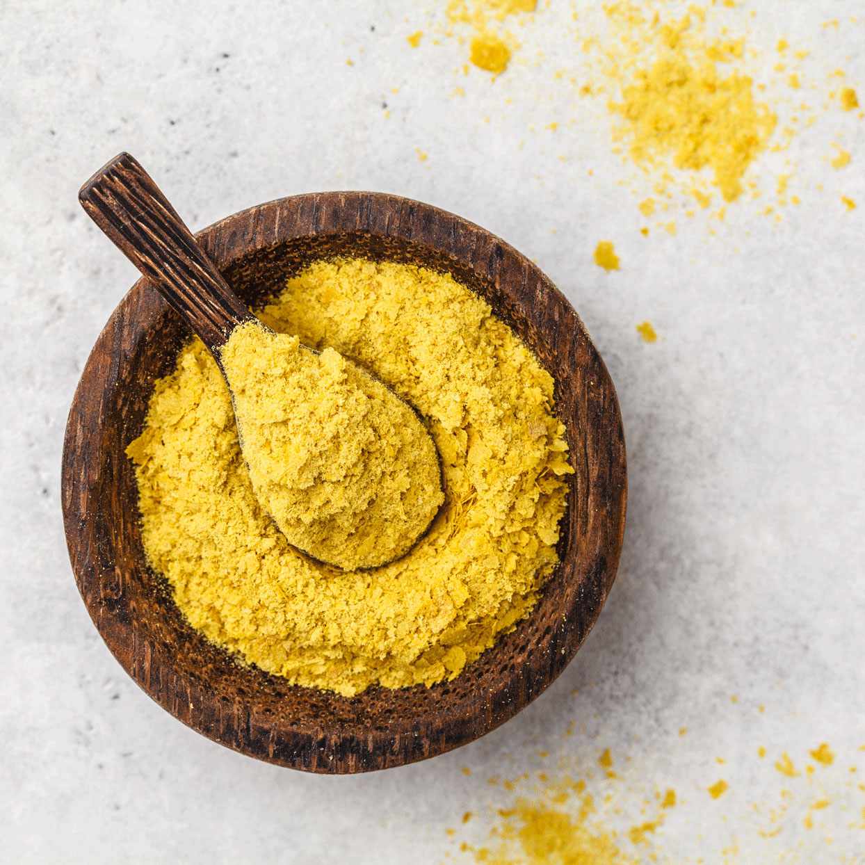 wooden bowl of nutritional yeast
