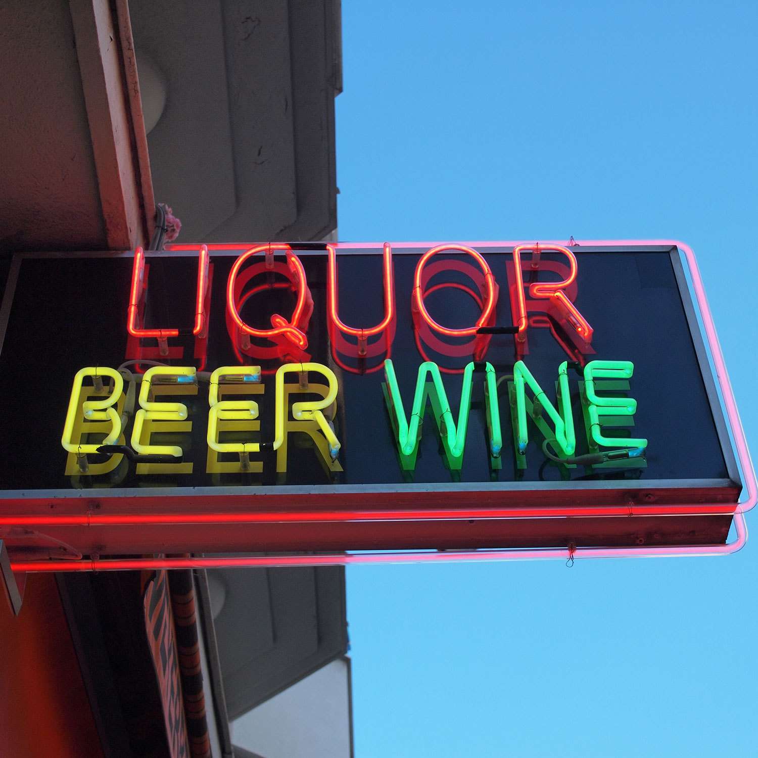 neon sign that reads "Liquor Beer Wine"