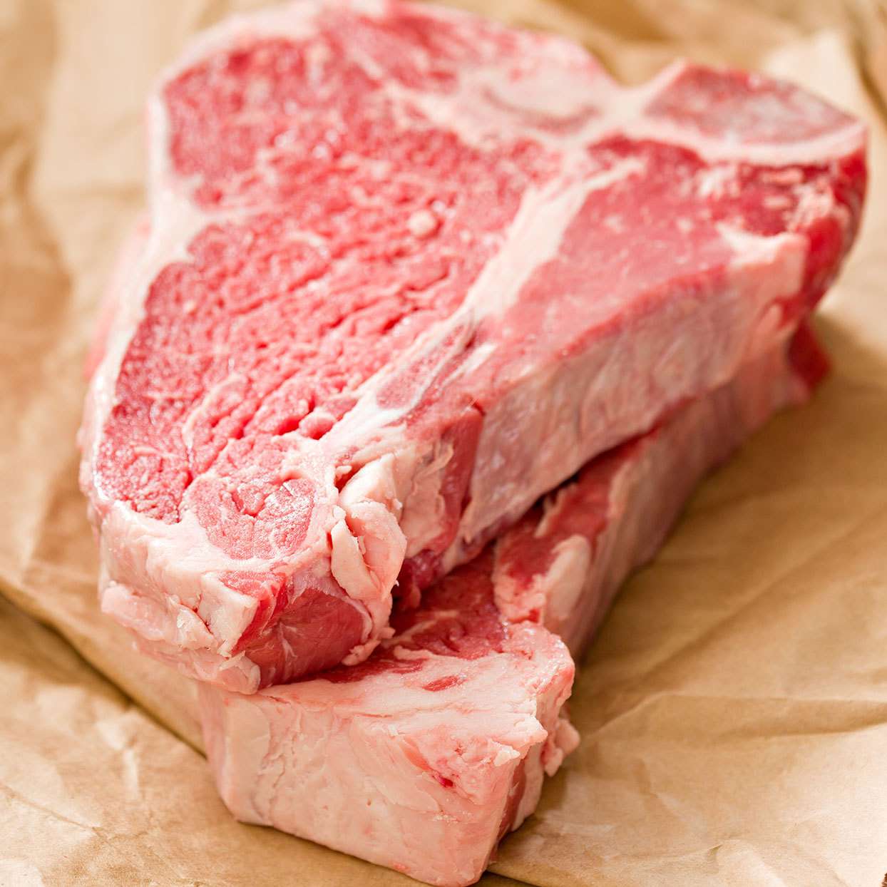 Two T-Bone Beef Steaks on Butcher Paper