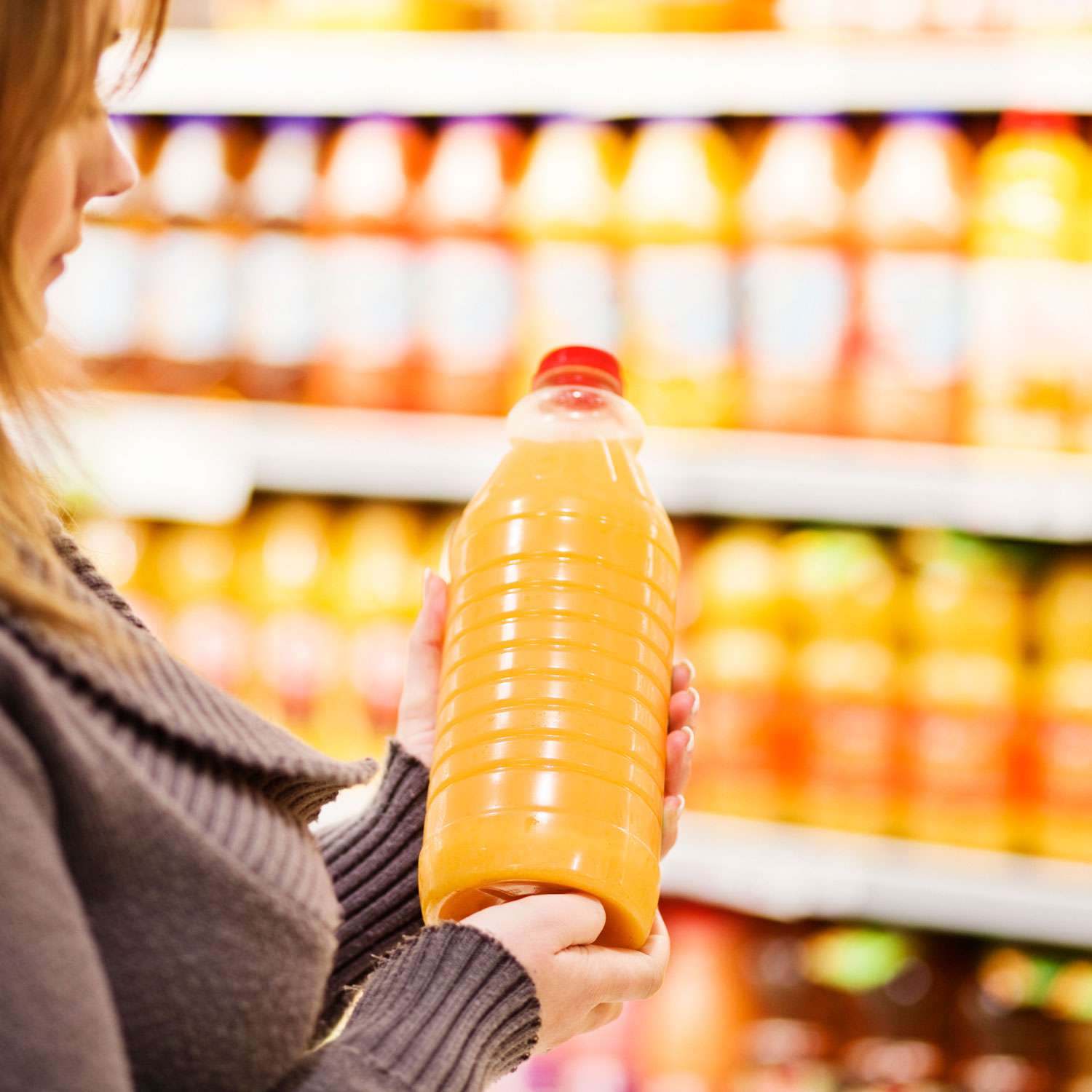 woman buying orange juice