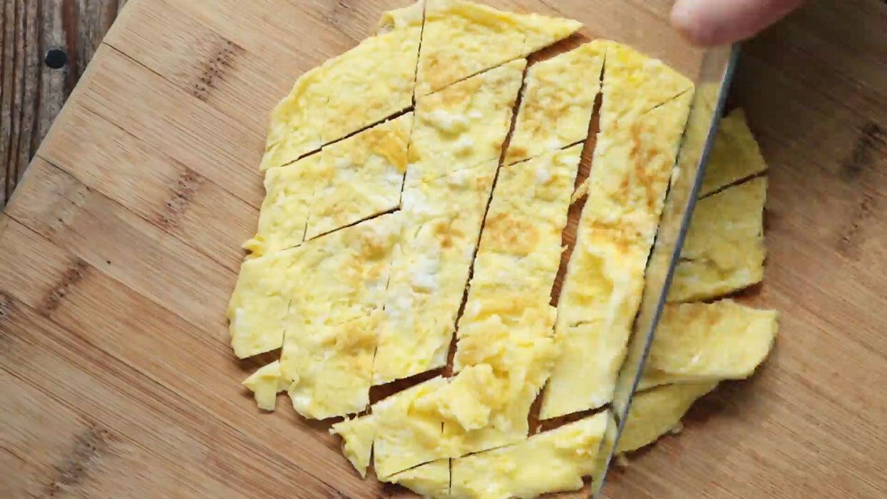 Scrambled eggs on a cutting board