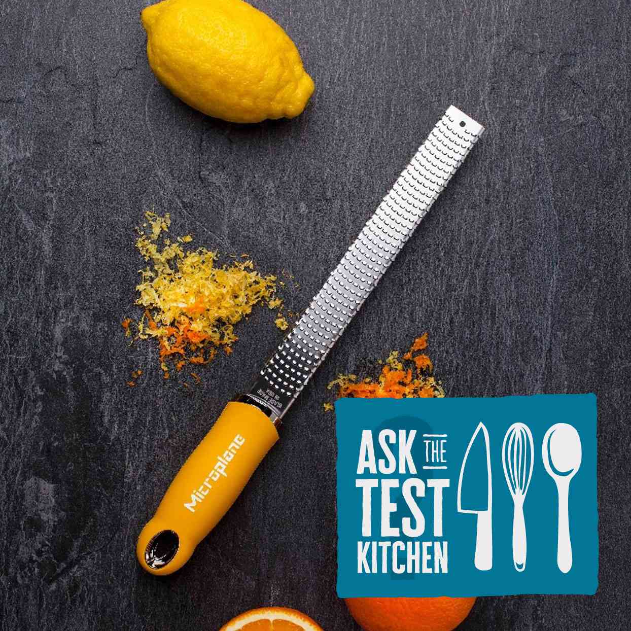 A Yellow Microplane Zester with a lemon and orange and Ask the Test Kitchen Logo