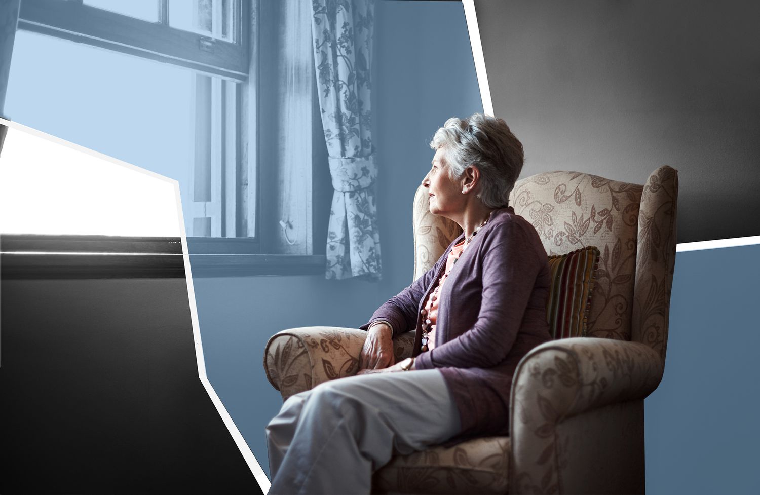 Older woman sitting in chair looking out the window