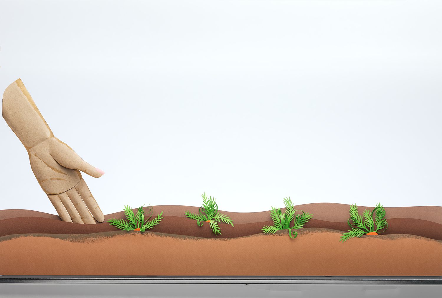 An illustration of a hand reaching into dirt with plants