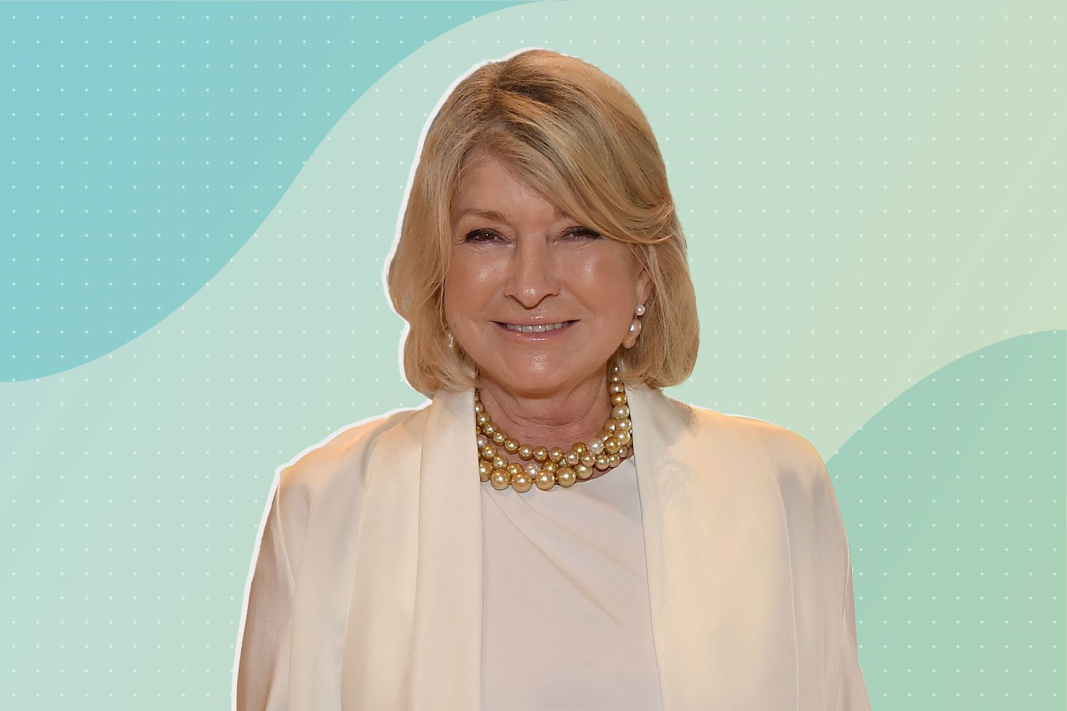 Martha Stewart smiling against a blue background