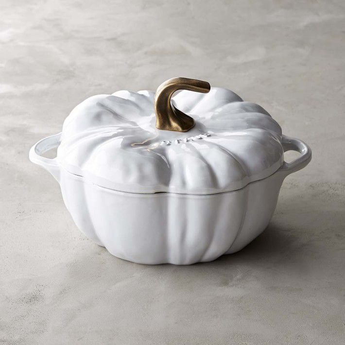 white pumpkin-shaped dutch oven on tan counter