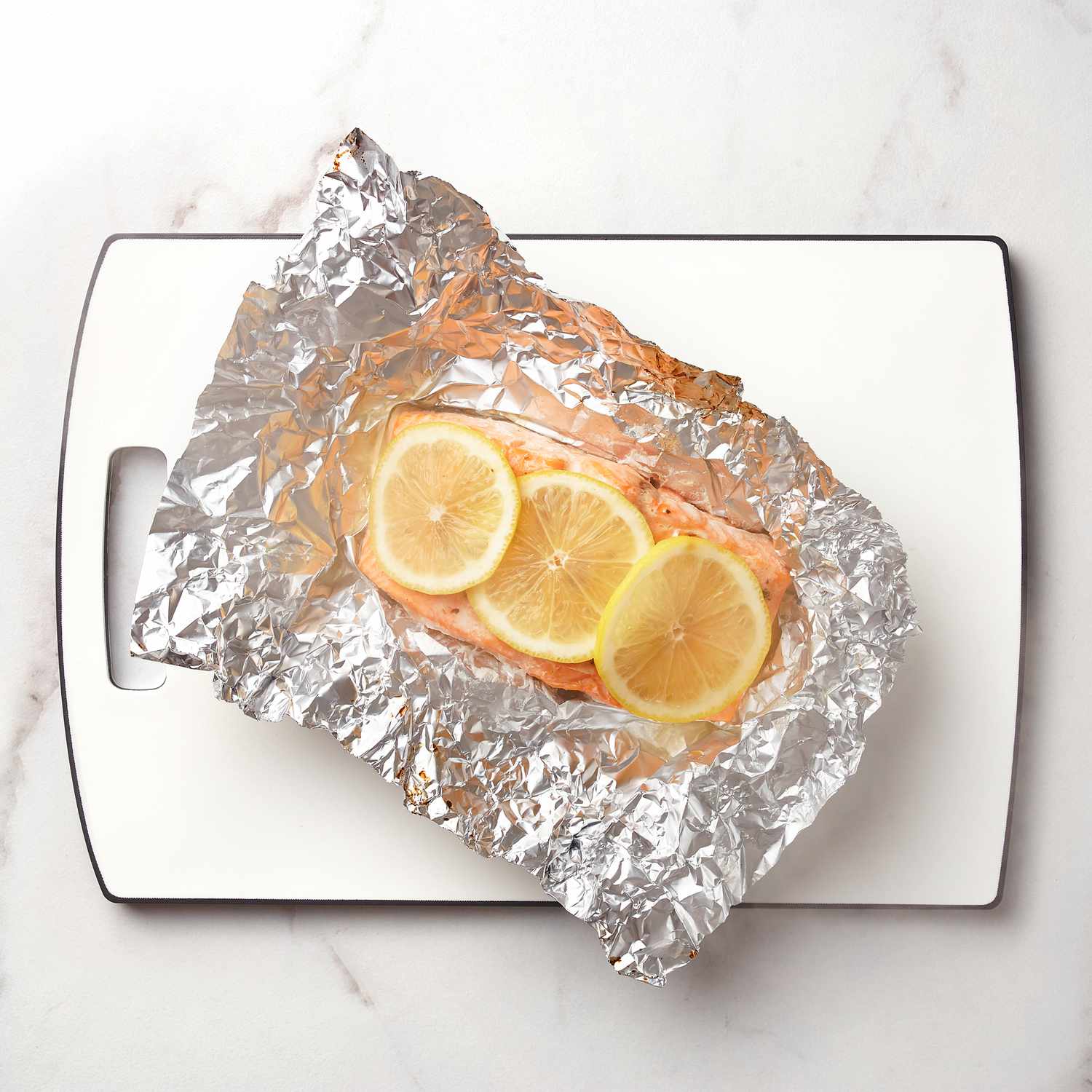 a steamed salmon fillet wrapped in tin foil