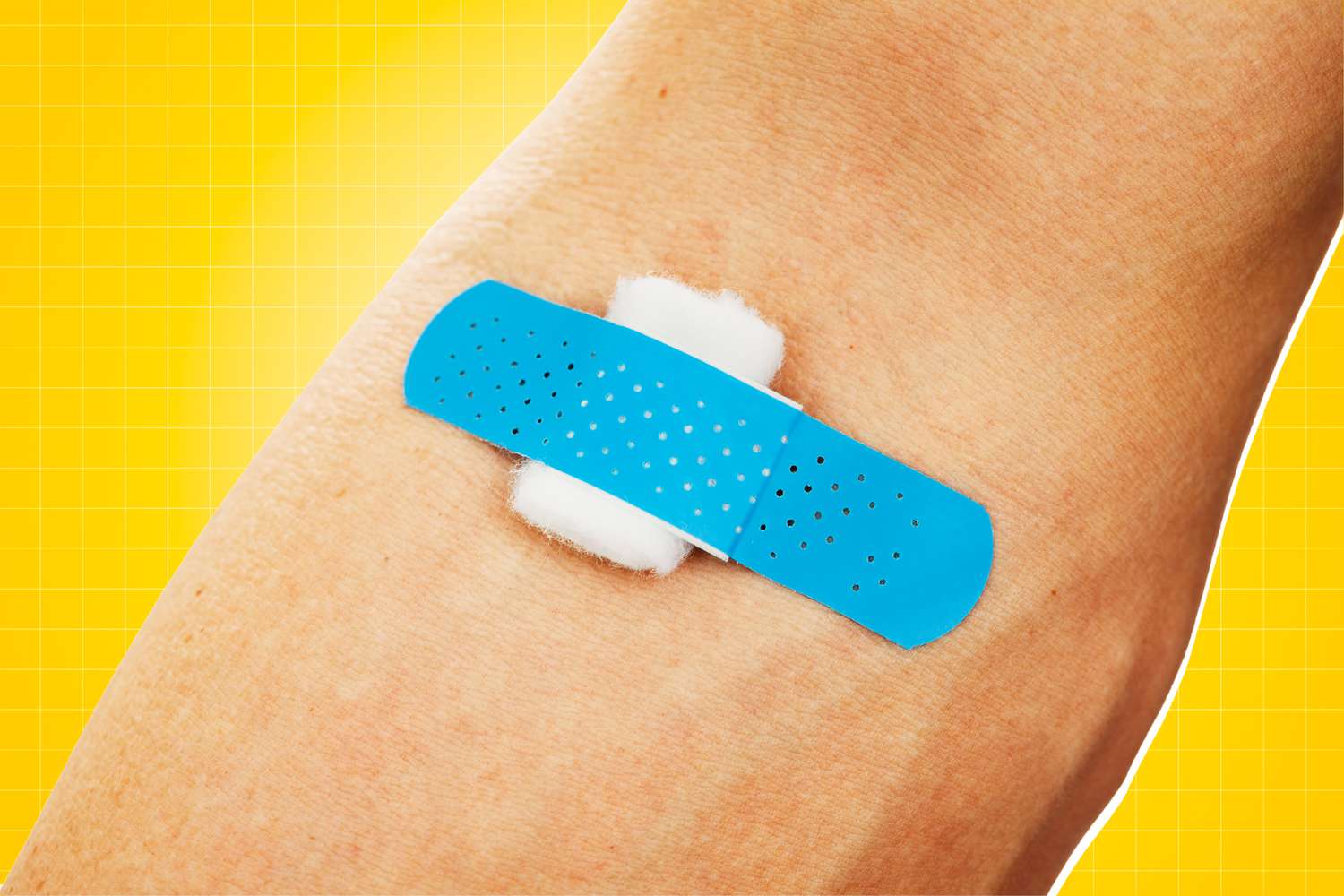 Bandage and gauze on an arm after a blood test or shot isolated on a designed background