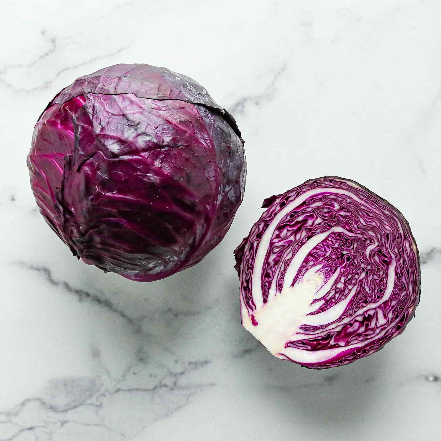 AA head of red cabbage on marble