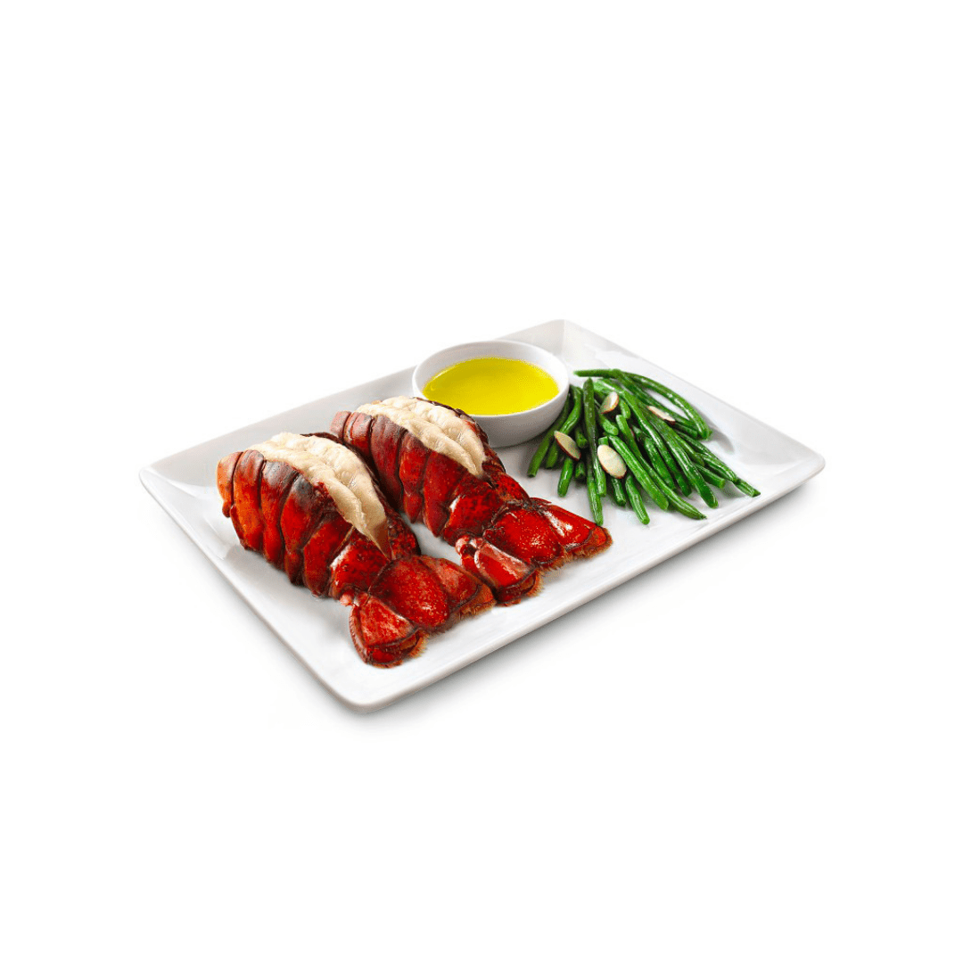 plate of two lobster tails and green beans