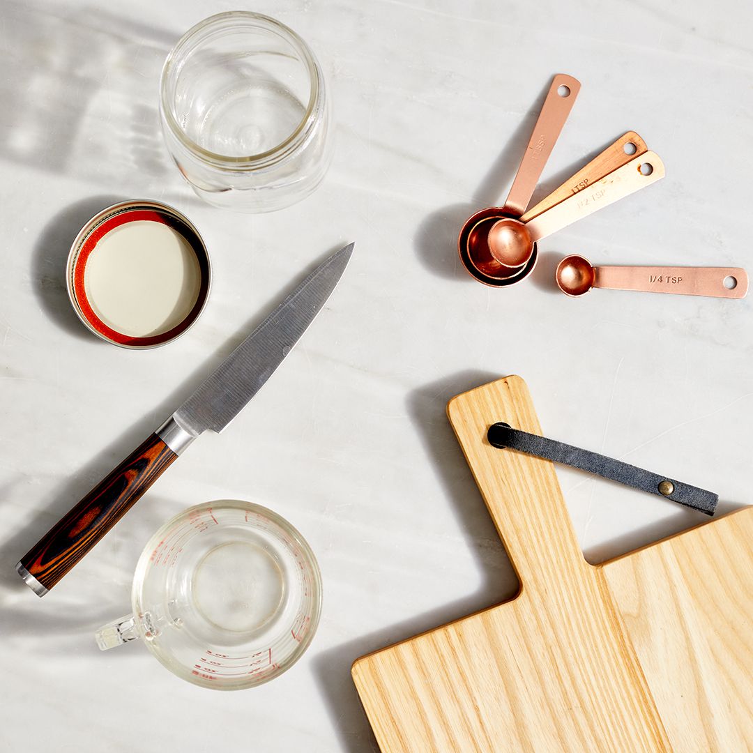 kitchen tools on a white marble surface