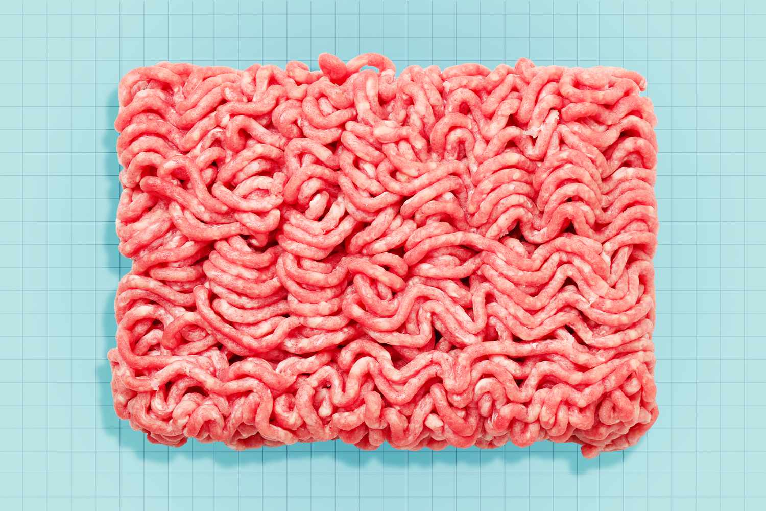 Ground beef on a designed background