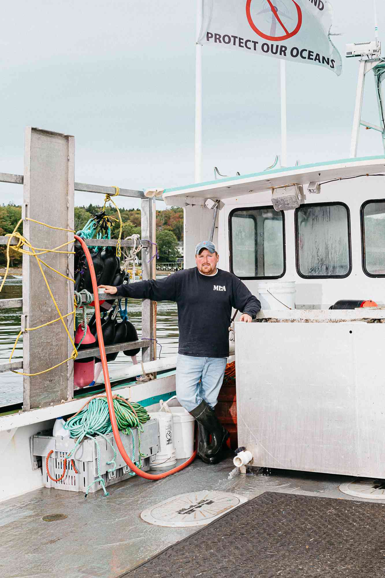 Captain Dustin Delano standing on the deck of a boat