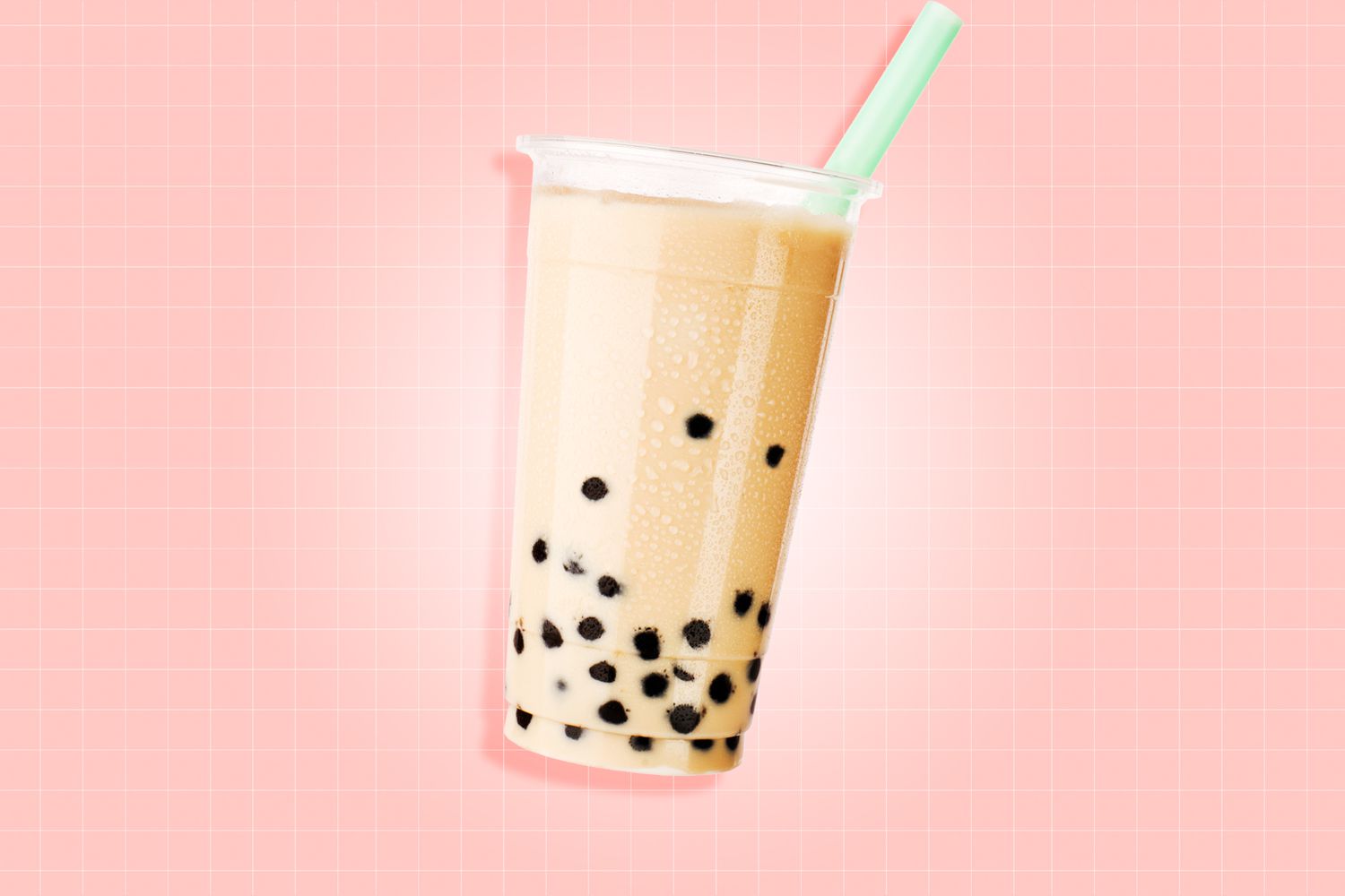 bubble tea with milk and tapioca pearls on a designed background