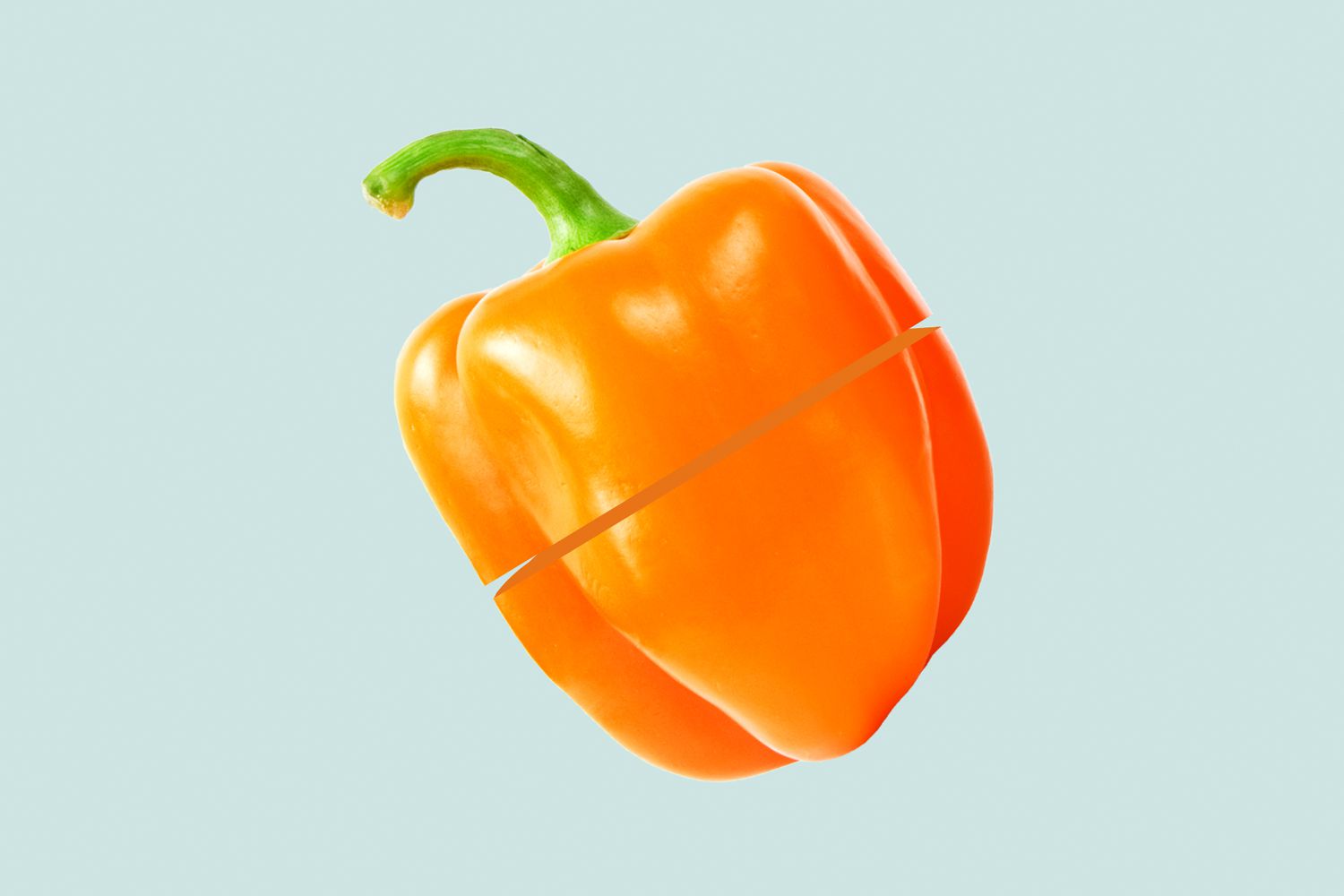 an orange bell pepper with a fake cut in the center