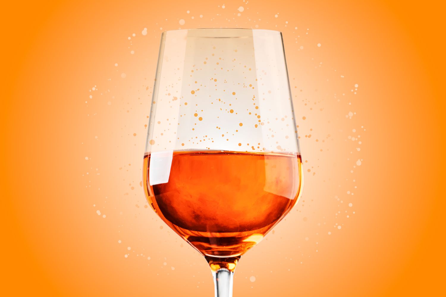 Aa glass of orange wine on a designed background