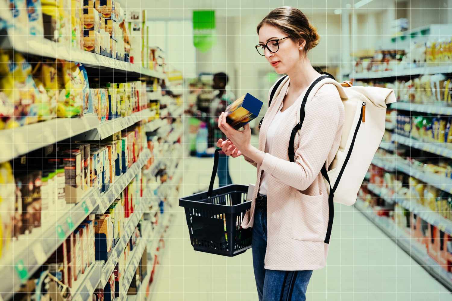 Woman Reading Food Item Label In Supermarket