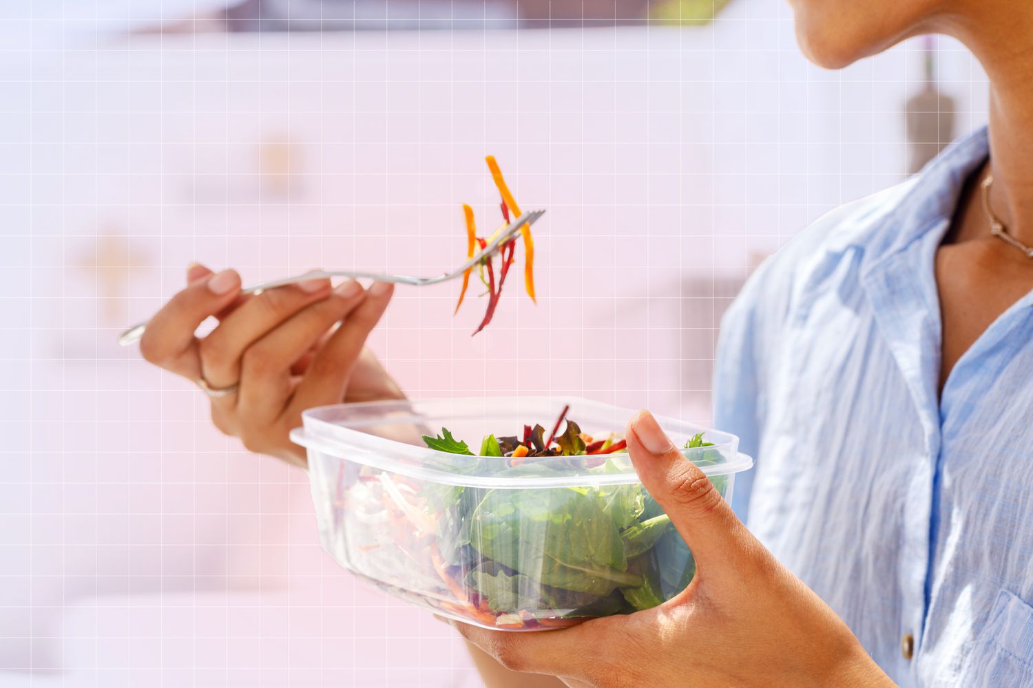 someone eating salad out of plastic container on designed background