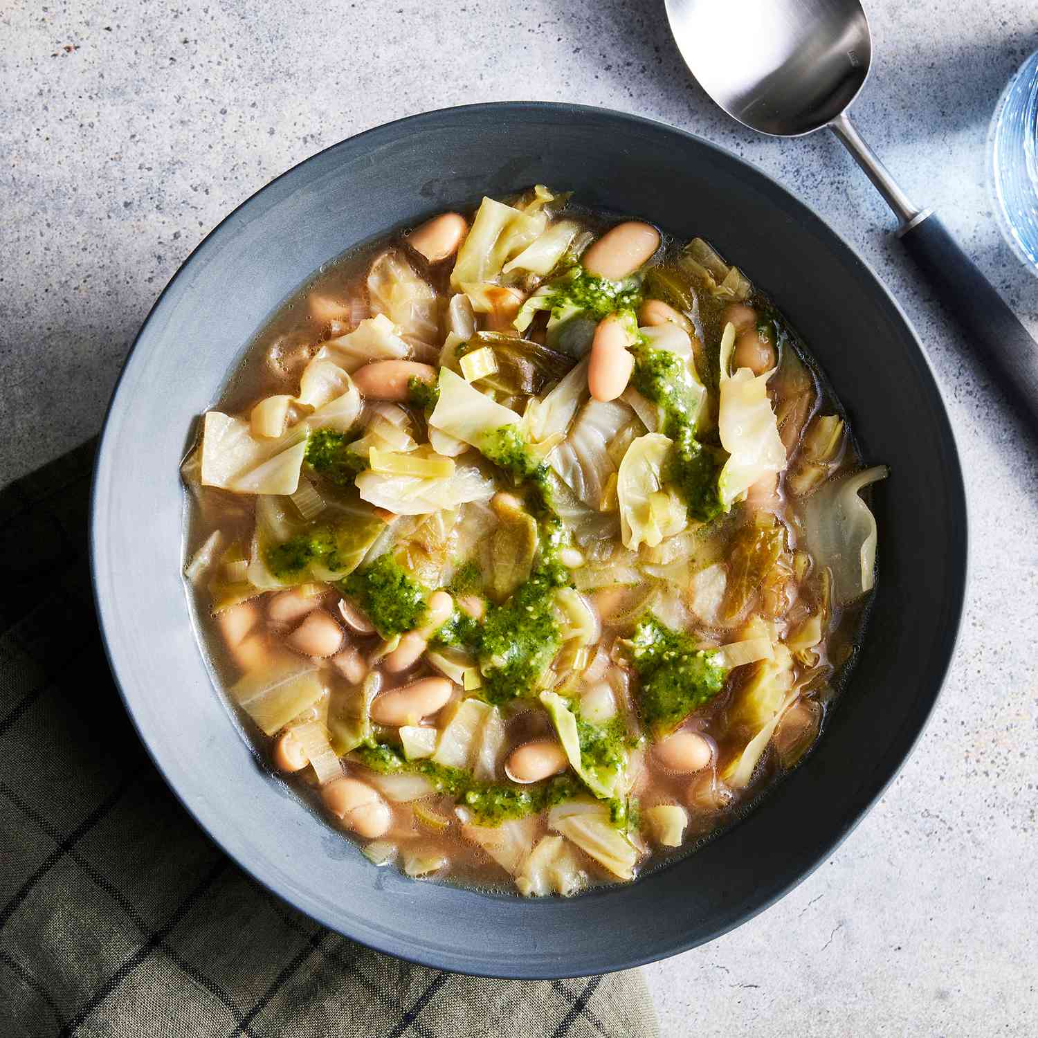 a recipe photo of the Cabbage & White Bean Soup served in a bowl