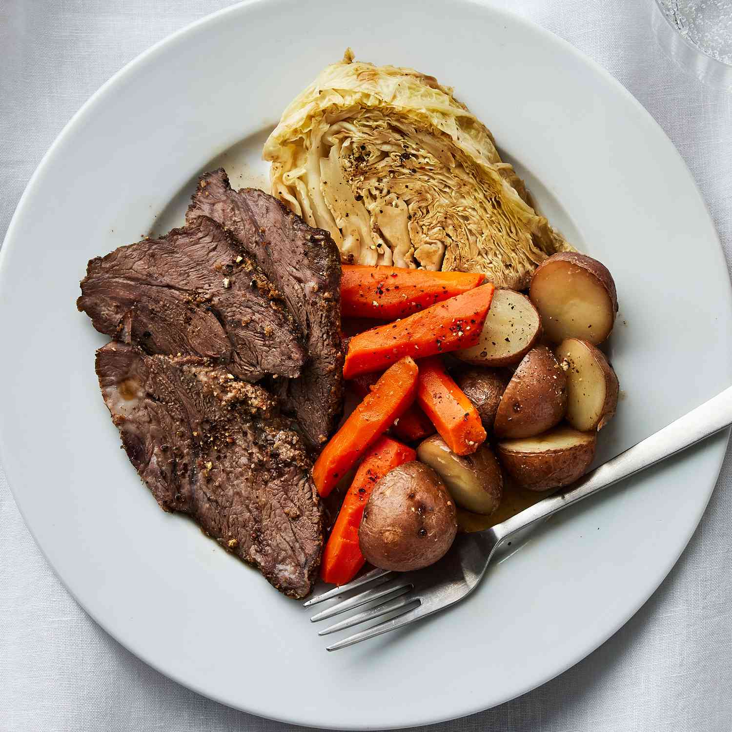 a recipe of the Baked Corned Beef & Cabbage served on a plate
