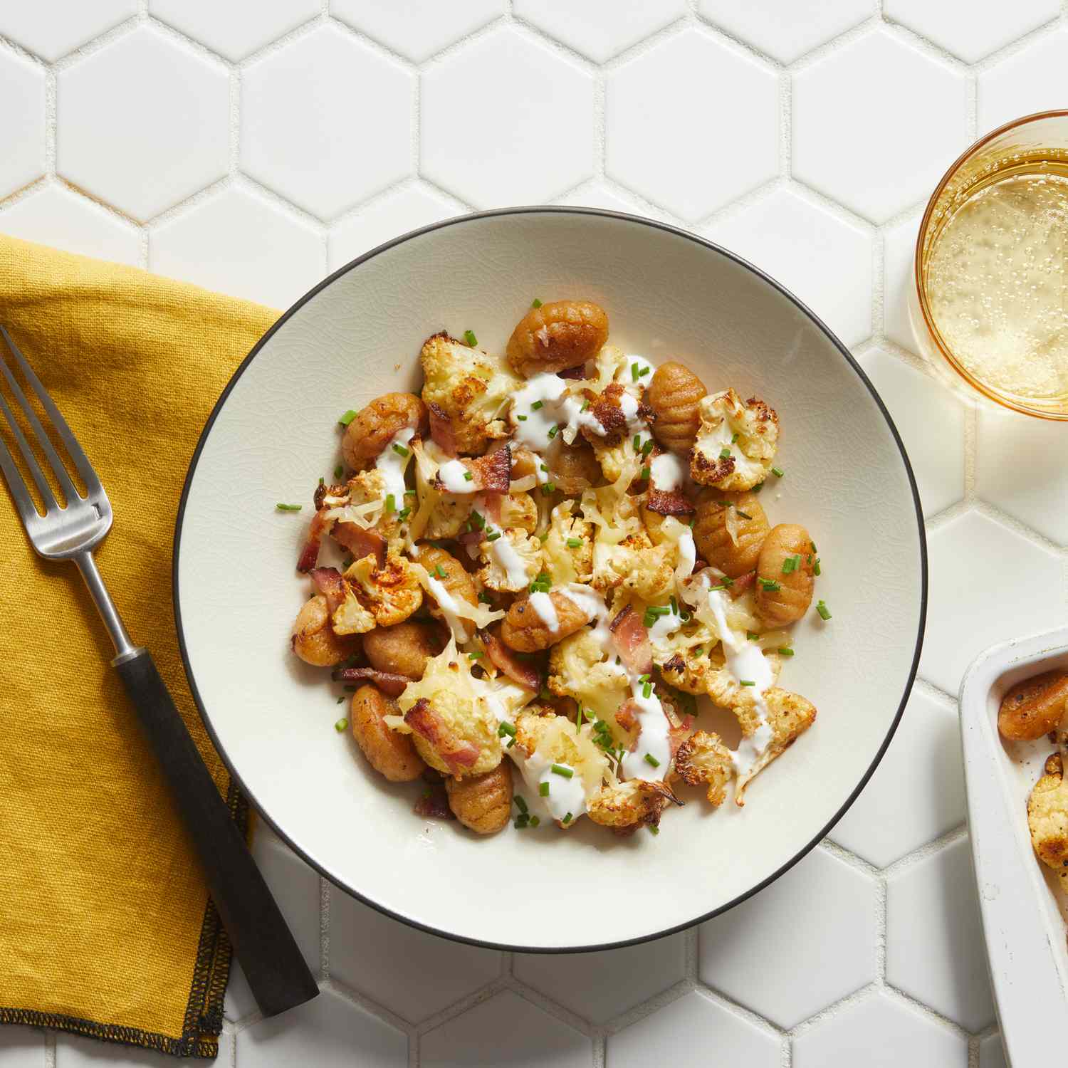a recipe photo of the Sheet-Pan Loaded Cauliflower Gnocchi served on a plate