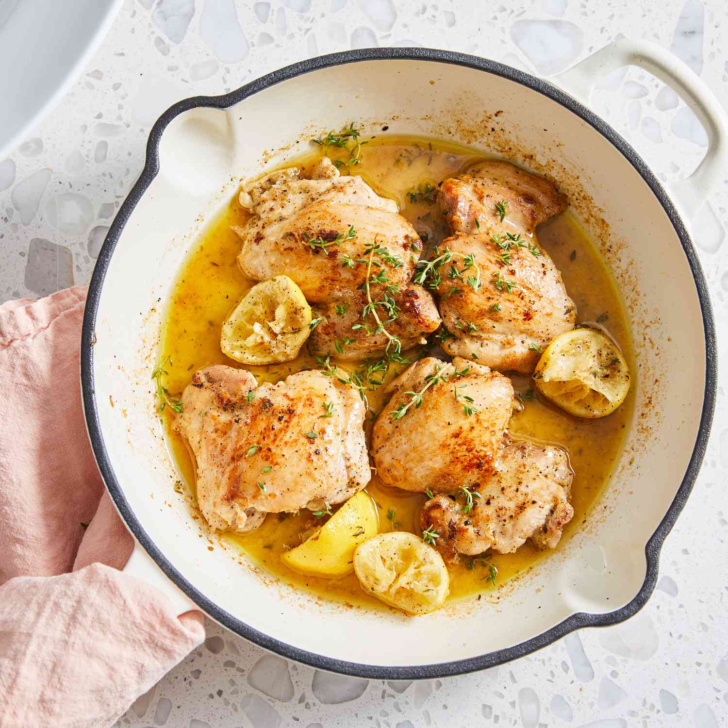 a recipe photo of the Lemon Garlic Boneless Chicken Thighs in a skillet